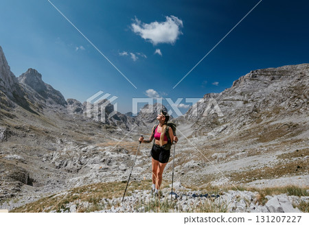 Young Woman on Summer Hiking Adventure in Mountains 131207227