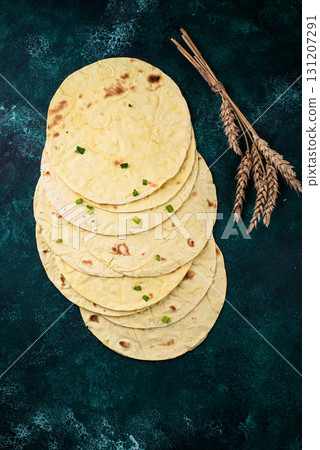 Lavash flat bread on green background Lavash flat bread on green background 131207291