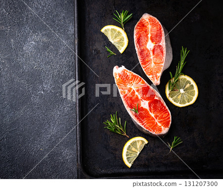 Raw uncooked salmon with rosemary Raw uncooked salmon with rosemary 131207300