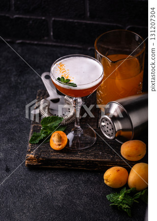 Fresh apricot cocktail martini with mint Fresh apricot cocktail martini with mint 131207304