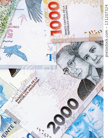 Argentine pesos money bills in big amount lies on white table close up. Finance and banking concept 131207324
