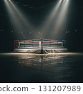 boxing ring is set under bright lights in a dimly lit arena. The red and blue ropes mark the space where fighters will soon compete. Reflections on the polished floor enhance the dramatic scene. 131207989