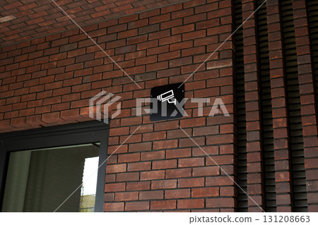 Security camera sign, emphasizing importance of surveillance for both private and commercial spaces. Highlighting role of technology in modern safety measures and crime prevention 131208663