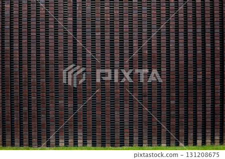 Close up of modern brick wall with textured pattern. Arrangement of bricks creates clean, geometric design, highlighting quality and craftsmanship of contemporary architecture 131208675