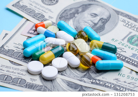 Many different pills capsules on money background. Symbol of high price on medicine 131208753