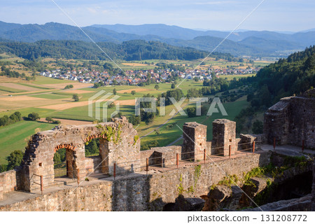 Beautiful landscape of dilapidated castle ruin against small village in Germany in the evening 131208772