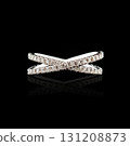 Beautiful white gold ring with diamonds on a black background close-up 131208873