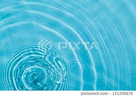 drops on water with circles on a blue background drops on water with circles on a blue background 131208878