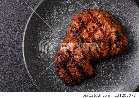 Meat, juicy beef steak grilled cooked to perfection for lunch. Barbecued steak Meat, juicy beef steak grilled cooked to perfection for lunch. Barbecued steak 131209078