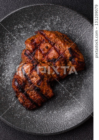 Meat, juicy beef steak grilled cooked to perfection for lunch. Barbecued steak Meat, juicy beef steak grilled cooked to perfection for lunch. Barbecued steak 131209079