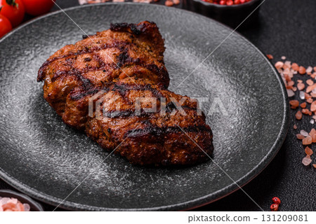 Meat, juicy beef steak grilled cooked to perfection for lunch. Barbecued steak 131209081