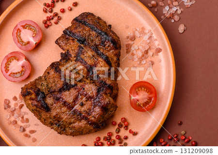 Meat, juicy beef steak grilled cooked to perfection for lunch. Barbecued steak Meat, juicy beef steak grilled cooked to perfection for lunch. Barbecued steak 131209098