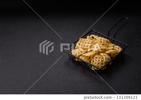 Lattice or wafer potato chips, crispy yellow snacks, takeaway food 131209121
