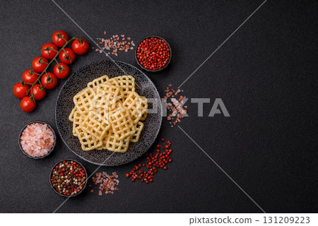 Lattice or wafer potato chips, crispy yellow snacks, takeaway food Lattice or wafer potato chips, crispy yellow snacks, takeaway food 131209223