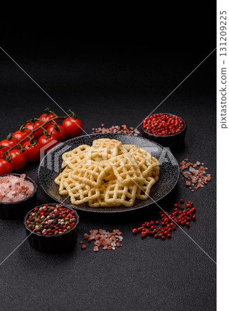 Lattice or wafer potato chips, crispy yellow snacks, takeaway food 131209225