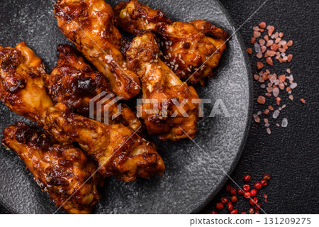 Grilled or barbecued chicken wings with teriyaki sauce, spices and sesame seeds. Teriyaki chicken 131209275