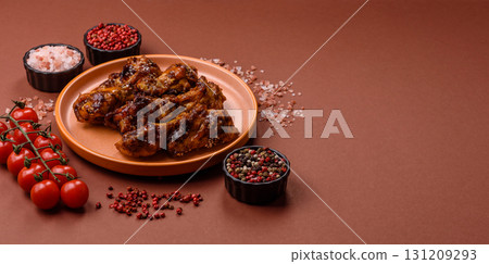 Grilled or barbecued chicken wings with teriyaki sauce, spices and sesame seeds. Teriyaki chicken Grilled or barbecued chicken wings with teriyaki sauce, spices and sesame seeds. Teriyaki chicken 131209293