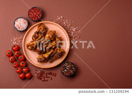 Grilled or barbecued chicken wings with teriyaki sauce, spices and sesame seeds. Teriyaki chicken Grilled or barbecued chicken wings with teriyaki sauce, spices and sesame seeds. Teriyaki chicken 131209294