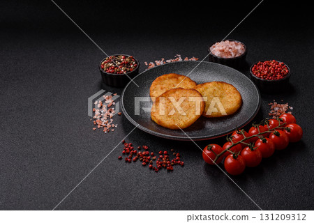 Hash browns, a breakfast food made of potatoes, onions and vegetables. Hash browns with potatoes 131209312