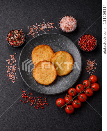 Hash browns, a breakfast food made of potatoes, onions and vegetables. Hash browns with potatoes 131209314