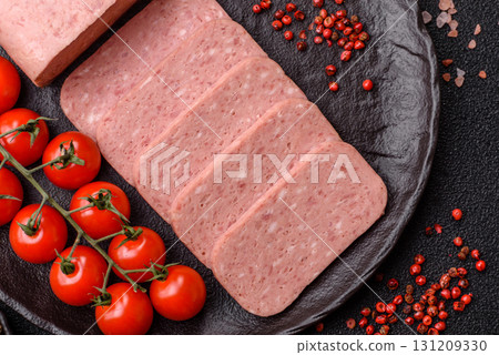 Food, meat, ham sliced in slices for the festive table. Spiced ham 131209330