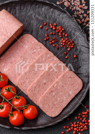 Food, meat, ham sliced in slices for the festive table. Spiced ham 131209331