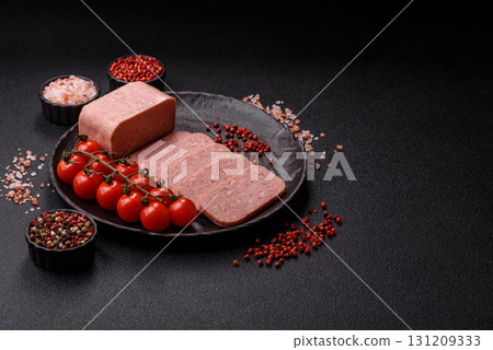 Food, meat, ham sliced in slices for the festive table. Spiced ham 131209333