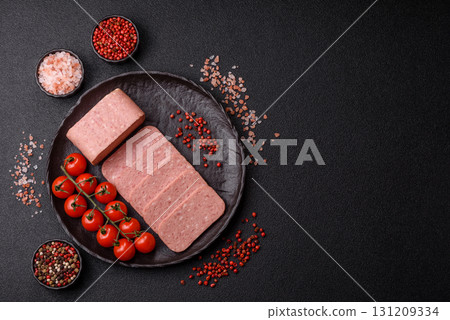 Food, meat, ham sliced in slices for the festive table. Spiced ham 131209334