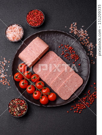 Food, meat, ham sliced in slices for the festive table. Spiced ham 131209335