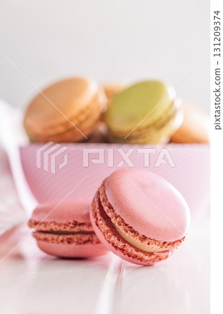 Different flavors of macarons. Colourful macaroons on white table. 131209374