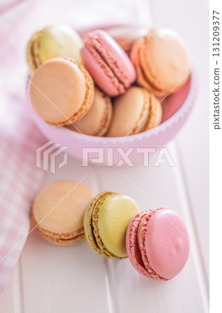 Different flavors of macarons. Colourful macaroons on white table. 131209377