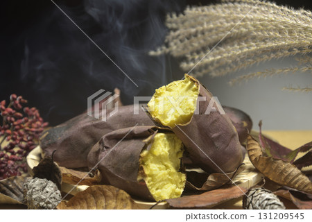 Stone-baked sweet potatoes create an autumnal image Stone-baked sweet potatoes create an autumnal image 131209545