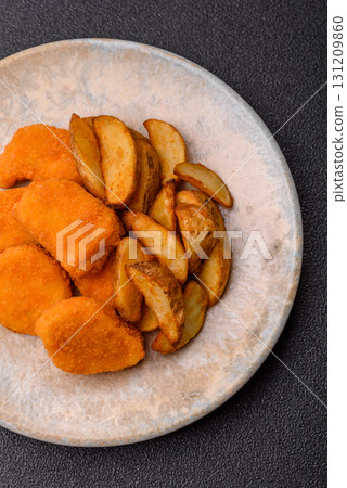 Crispy chicken nuggets, meat takeaway meal with salt. Chicken nuggets, fast food Crispy chicken nuggets, meat takeaway meal with salt. Chicken nuggets, fast food 131209860