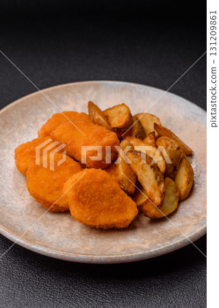Crispy chicken nuggets, meat takeaway meal with salt. Chicken nuggets, fast food 131209861