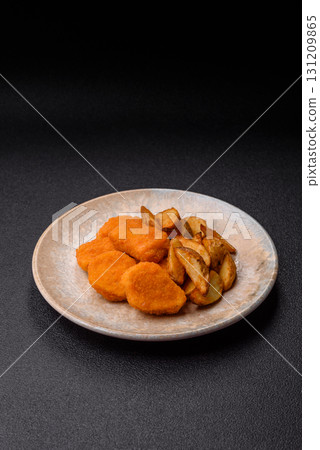 Crispy chicken nuggets, meat takeaway meal with salt. Chicken nuggets, fast food 131209865