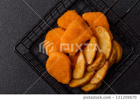 Crispy chicken nuggets, meat takeaway meal with salt. Chicken nuggets, fast food Crispy chicken nuggets, meat takeaway meal with salt. Chicken nuggets, fast food 131209870