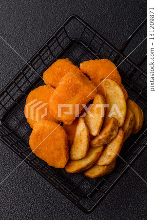 Crispy chicken nuggets, meat takeaway meal with salt. Chicken nuggets, fast food Crispy chicken nuggets, meat takeaway meal with salt. Chicken nuggets, fast food 131209871