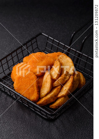 Crispy chicken nuggets, meat takeaway meal with salt. Chicken nuggets, fast food Crispy chicken nuggets, meat takeaway meal with salt. Chicken nuggets, fast food 131209872