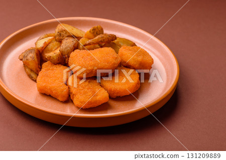 Crispy chicken nuggets, meat takeaway meal with salt. Chicken nuggets, fast food Crispy chicken nuggets, meat takeaway meal with salt. Chicken nuggets, fast food 131209889