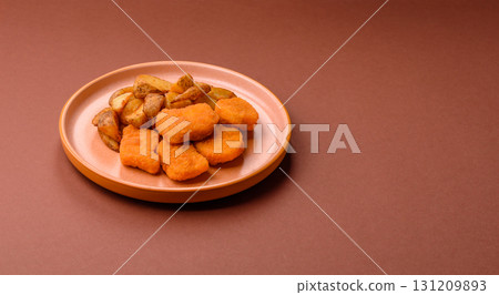 Crispy chicken nuggets, meat takeaway meal with salt. Chicken nuggets, fast food 131209893