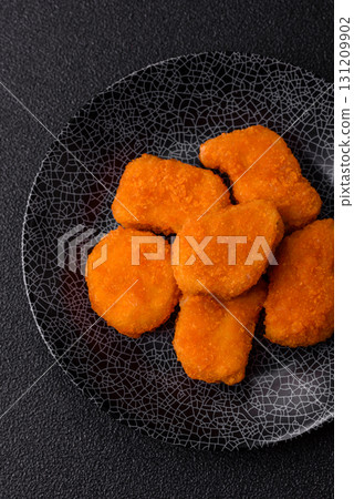 Crispy chicken nuggets, meat takeaway meal with salt. Chicken nuggets, fast food Crispy chicken nuggets, meat takeaway meal with salt. Chicken nuggets, fast food 131209902