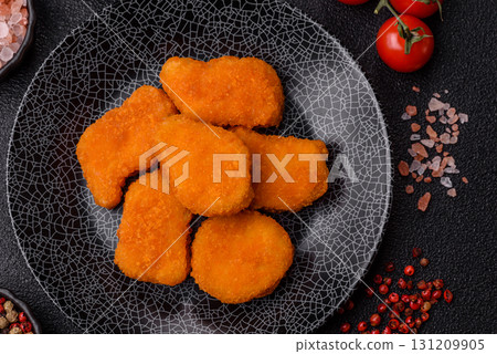 Crispy chicken nuggets, meat takeaway meal with salt. Chicken nuggets, fast food 131209905