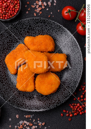 Crispy chicken nuggets, meat takeaway meal with salt. Chicken nuggets, fast food Crispy chicken nuggets, meat takeaway meal with salt. Chicken nuggets, fast food 131209906