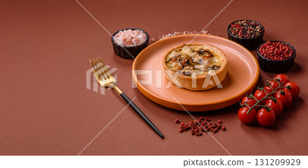 Pie or quiche, a sour tart with chicken and mushrooms, spices and herbs. Round quiche with chicken 131209929