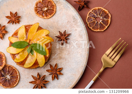Sweet round pie or tart with apples and peach. Mini sweet tart Sweet round pie or tart with apples and peach. Mini sweet tart 131209966
