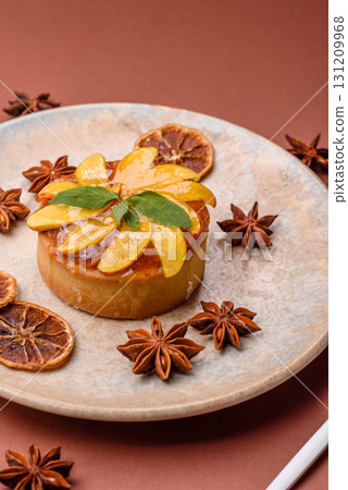 Sweet round pie or tart with apples and peach. Mini sweet tart 131209968