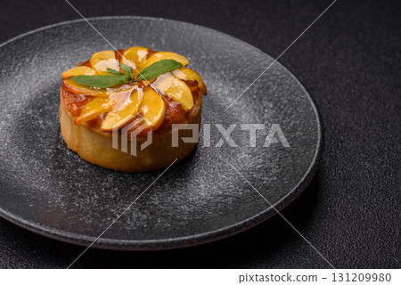 Sweet round pie or tart with apples and peach. Mini sweet tart 131209980