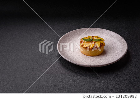 Sweet round pie or tart with apples and peach. Mini sweet tart 131209988