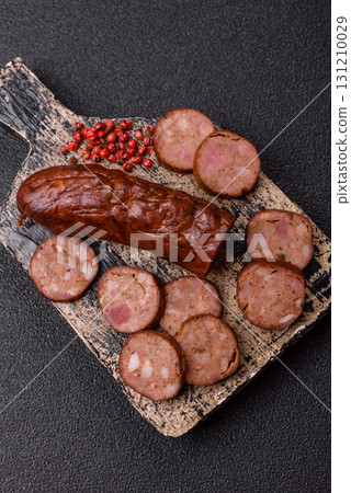 Homemade meat or vegan sausage grilled with spices. Homemade sausage cooked on barbecue 131210029
