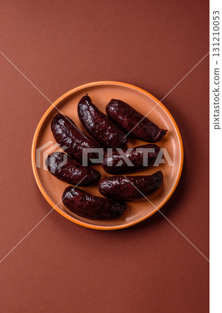 Blood sausage, pudding, meat food with lard and spices. Blood sausage Blood sausage, pudding, meat food with lard and spices. Blood sausage 131210053